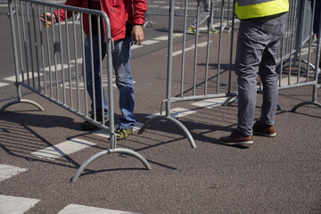 Security workers set up a barrier at a marathon