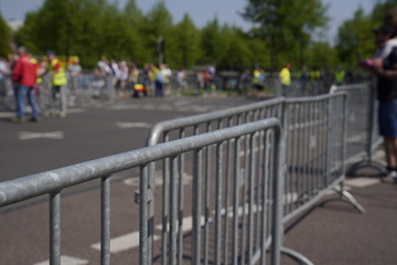 Marathon barrier with blurred people in the background