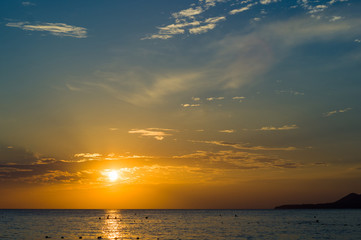 Amazing sea sunset, the sun, waves, clouds