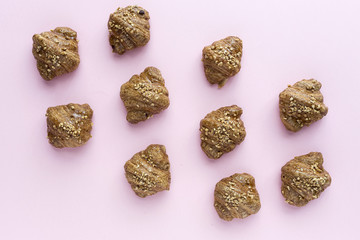 Croissant with almonds on pink bacground