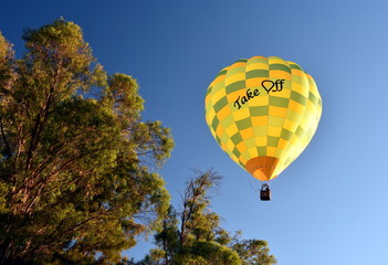 Fototapeta premium Canberra, Australia - March 10, 2018. Yellow Hot air balloon with 
