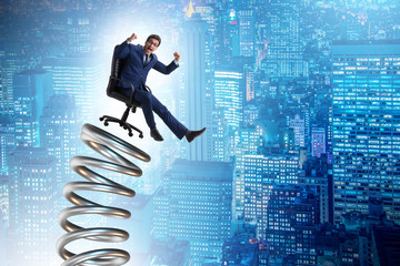 Businessman jumping from spring in promotion concept