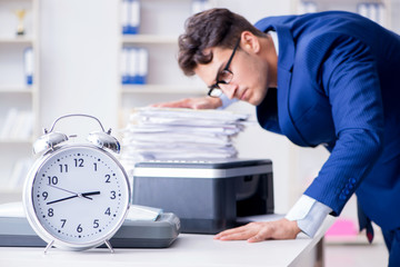 Businessman making copies in copying machine