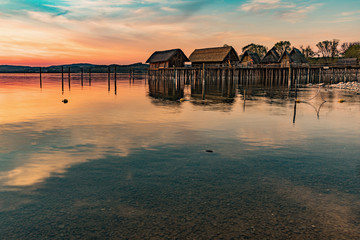 Colorfull sunset at Lake Dwellings of the Stone and Bronze Age in Unteruhldingen on Lake Constance, Baden-Wurttemberg