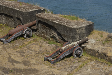 Old cannon on the battlements of the historic Niebla Fort protecting the approach to the former Spanish colonial city of Valdivia in southern Chile
