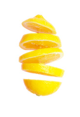 Flying lemon. Sliced lemon isolated on white background. Levity fruit