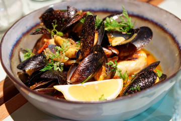 Mussels in a deep clay bowl