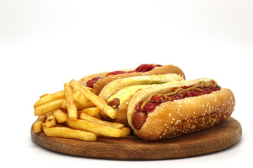 Hot dogs and French fries on white background.