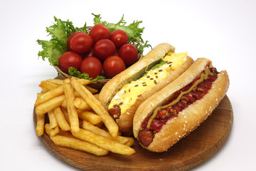 Hot dogs and French fries on white background.