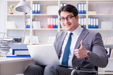 Disabled businessman working in the office