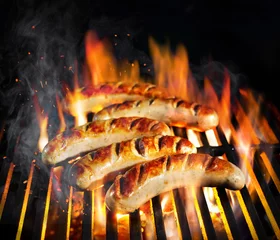 Zelfklevend Fotobehang Grilled sausage on the flaming grill © Alexander Raths
