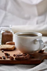 Fotobehang Breakfast background with mug of fresh coffee, homemade oatmeal cookies, grind coffee © Aleksey