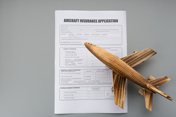 aircraft insurance application and an airplane model concept of travel insurance