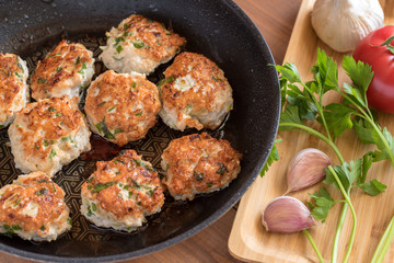Fried turkey cutlets in a pan.