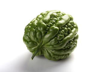 Obraz premium side view fresh green bitter melon on a white background