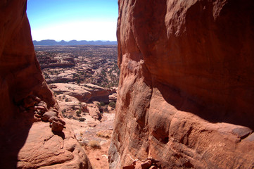 View from huge gap in red rock cliffs in the canyon country of the Bears ears area of Southern Utah in the desert badlands of Bisti De Na Zin In Notthern New Mexico