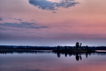 The pink sunset on the lake.