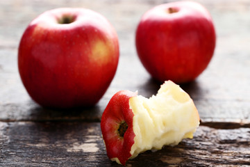 Red apples on grey wooden table
