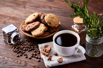 Breakfast background with mug of fresh coffee, homemade oatmeal cookies, grind coffee
