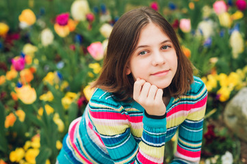 Outdoor portrait of young preteen 12 year old girl