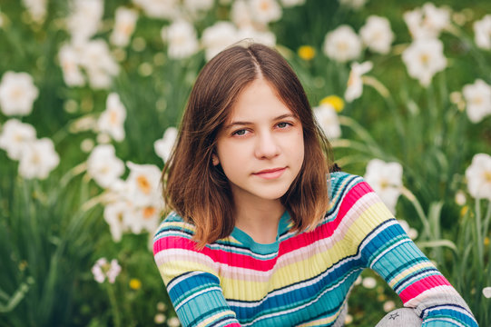 Outdoor portrait of young preteen 12 year old girl