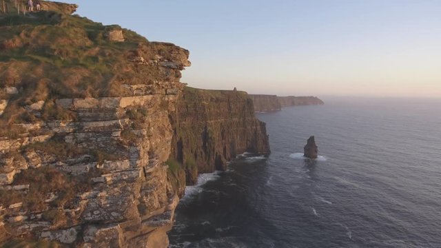 Beautiful Scenic Aerial drone view of Ireland Cliffs Of Moher in County Clare. Sunset over the Cliffs of Moher. Epic Irish rural countryside landscape along the wild atlantic way.