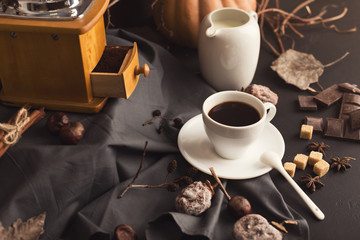 Coffee cup and sweets on vintage wooden table