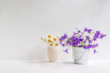 Summer flowers in a metal bucket