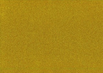 Fototapeta premium Gold glitter paper. Abstract background with small granules, noises.
