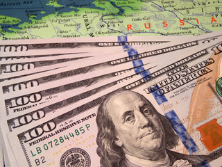 US dollars on the map of Russia. Russian economy, exchange rate concept