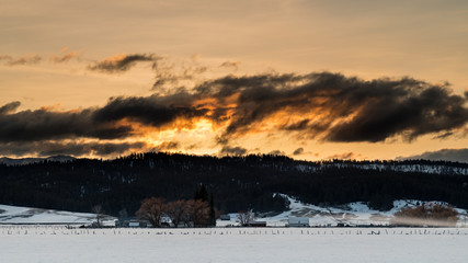 Dramatic winter sunrise over an Idaho farm