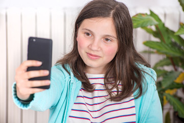 young teen girl making a selfie