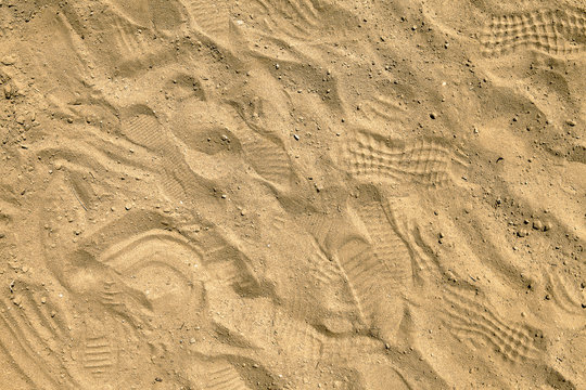 Footprints In Sand On Playpit. Top View. Sand In Sand-pit, Overhead Shot. Sandbox Background. Sandpit Desktop Background. Moulding Sand Quarry Desktop Picture.