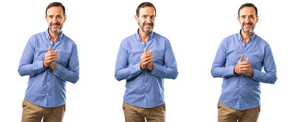 Middle age handsome man confident and happy with a big natural smile laughing over white background