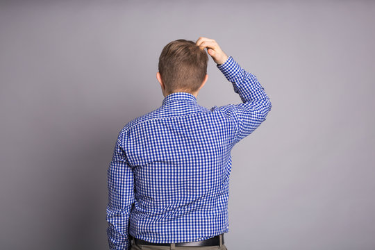 Forgetful Absent Minded Man Is Trying To Remember Something, Back View