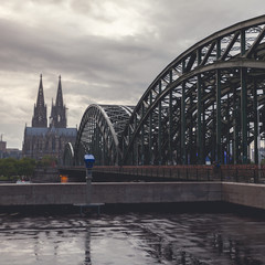 View on Cologne Cathedral and Hohenzollern Bridge, in the rain. Germany. Panorama of the city