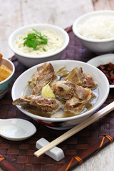 singare bak kut teh, spicy pork rib soup isolated on white background
