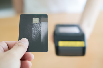 Close up of customer paying by credit card