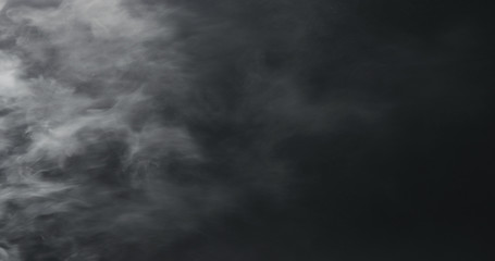 vapor steam over black background