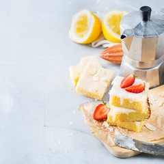 Homemade lemon polenta cookie bars with white icing
