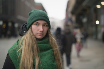 teen girl portrait on pedestrian street on a spring day