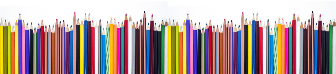 Colored pencils on table.