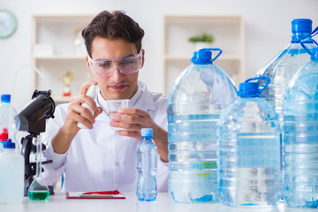 Lab assistant testing water quality