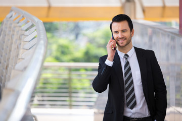 Businessman speaking on smart phone