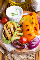 Grilled vegetables with sauce, zucchini, bell peppers, red onions, tomatoes, summer