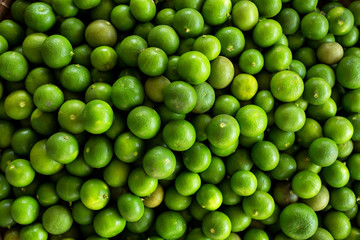 Fresh green limes on wooden in Thailand,copy space.