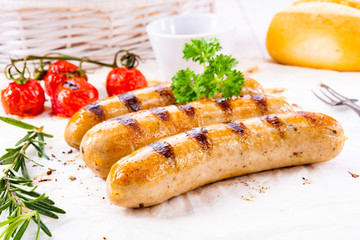 delicious bratwurst with ketchup and fresh rolls