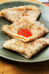 Sourdough pancakes with red salmon caviar