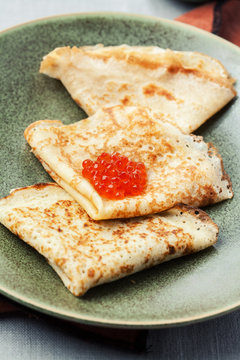 Sourdough pancakes with red salmon caviar