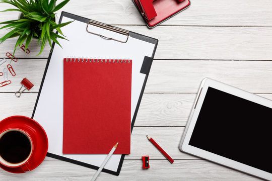 white table boards folder red notepad cup morning coffee clock paper clip workflow preparation